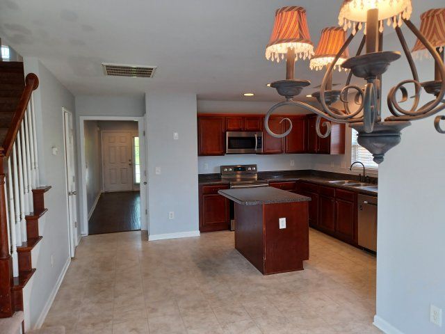 Privacy Fenced Back Yard. Storage Bldg. Fireplace. Washer & Dryer. Master BR downstairs property image
