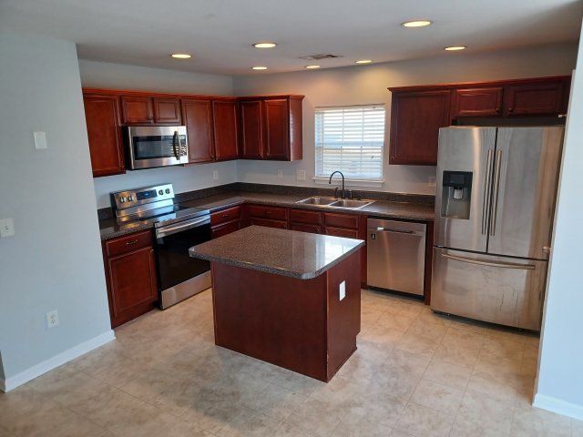 Privacy Fenced Back Yard. Storage Bldg. Fireplace. Washer & Dryer. Master BR downstairs property image