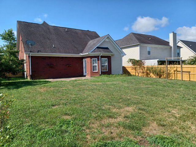 Privacy Fenced Back Yard. Storage Bldg. Fireplace. Washer & Dryer. Master BR downstairs property image