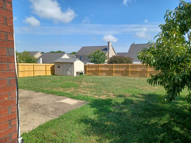 Privacy Fenced Back Yard. Storage Bldg. Fireplace. Washer & Dryer. Master BR downstairs property image